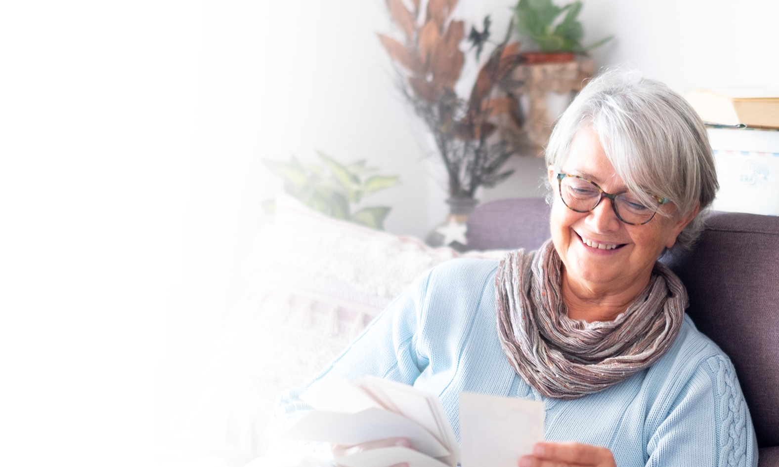 Woman Reading Card Smiling